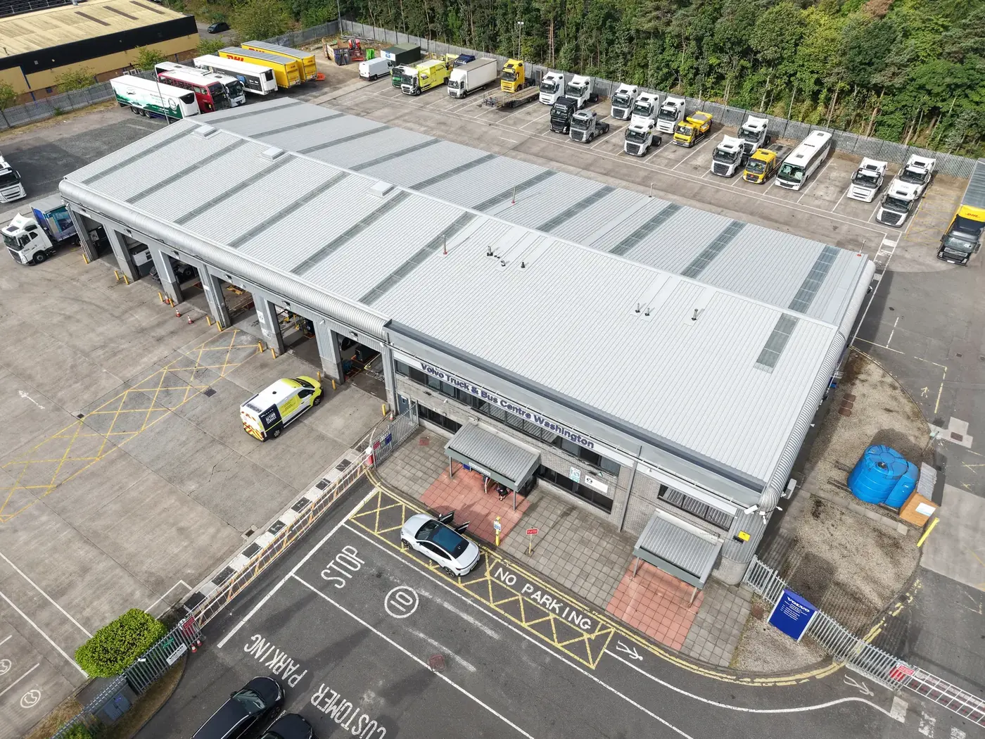 New profiled steel roof after 240mm insulated over-cladding, truck dealership